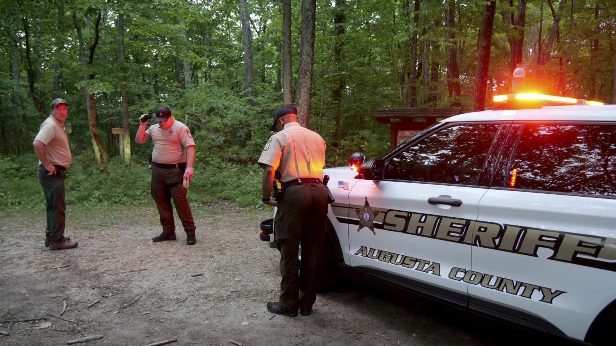 Authorities secure the entrance to Mine Bank Trail, along the Blue Ridge Parkway where a Cessna Citation crashed over mountainous terrain near Montebello, Va., Sunday.