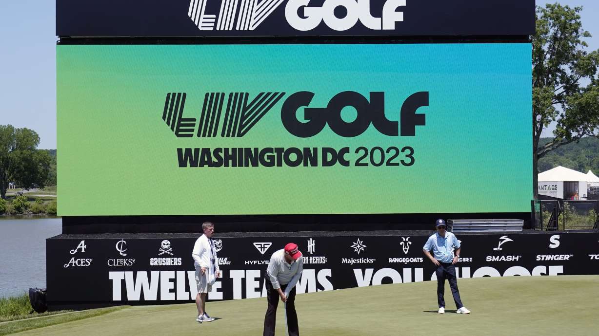 Former President Donald Trump plays during the LIV Golf Pro-Am at Trump National Golf Club, Thursday in Sterling, Va. The PGA Tour and European tour have agreed to a merger with Saudi Arabia's golf interests.