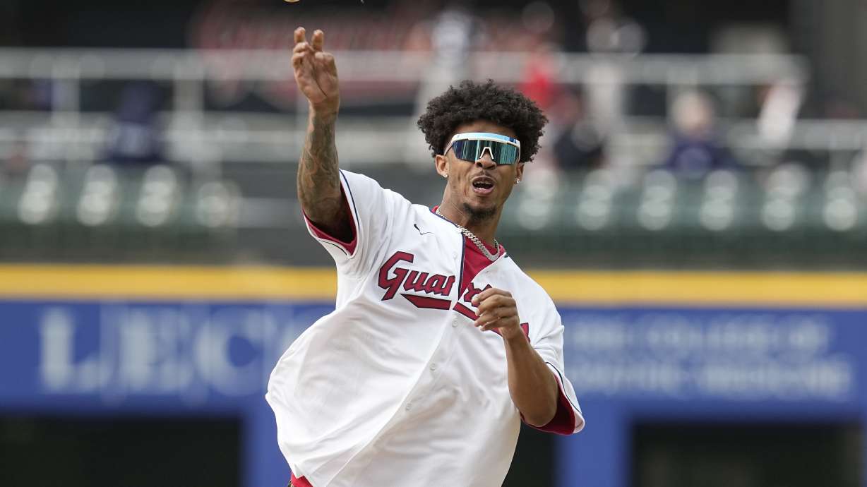 Cleveland Browns cornerback Greg Newsome II throws out a ceremonial first pitch before a baseball game between the Chicago White Sox and the Cleveland Guardians, Monday, May 22, 2023, in Cleveland.
