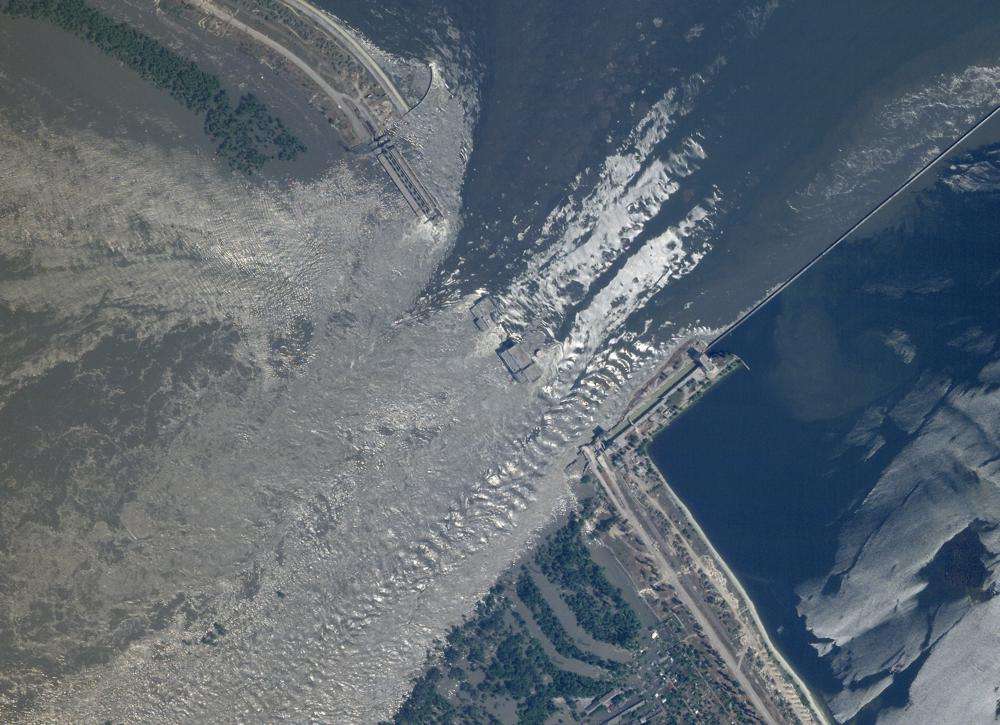 This satellite image shows an overview of the damage on the Kakhovka dam in southern Ukraine on Tuesday. Ukraine accused Russian forces Tuesday of blowing up the Kakhovka dam and hydroelectric power station on the Dnieper River in an area that Moscow controls, while Russian officials blamed Ukrainian bombardment in the contested area. It was not possible to verify the claims.