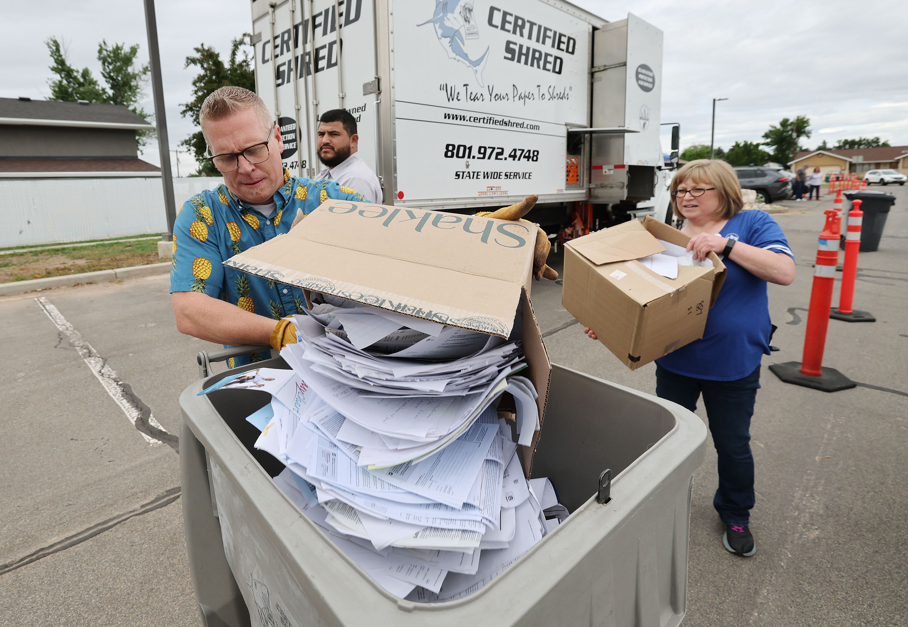 Brady Lane and Shantel Clark, Weber Human Services workers, shred documents at the Roy Hillside Senior Center in Roy on June 2. An organization is advising Medicare beneficiaries to watch for allergy tests they never requested nor received.