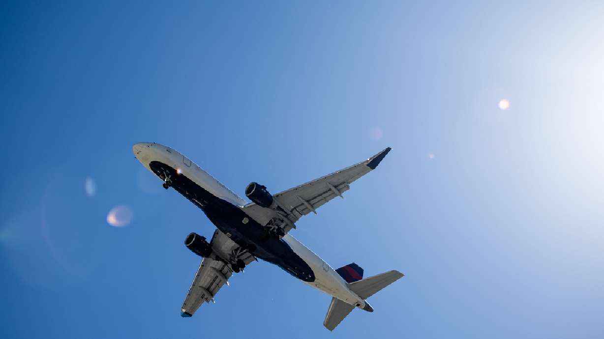 A SkyWest Airlines Embraer ERJ-175 jet approaches Salt Lake International Airport on Sept. 24, 2022. Airline employee unions are sounding off about SkyWest's plan to operate charter flights and get around some pilot-training rules.