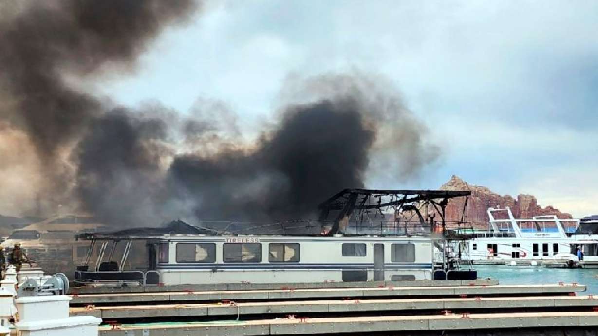 Smoke rises from a fire at Wahweap Marina on Lake Powell near Page, Ariz., on Friday.