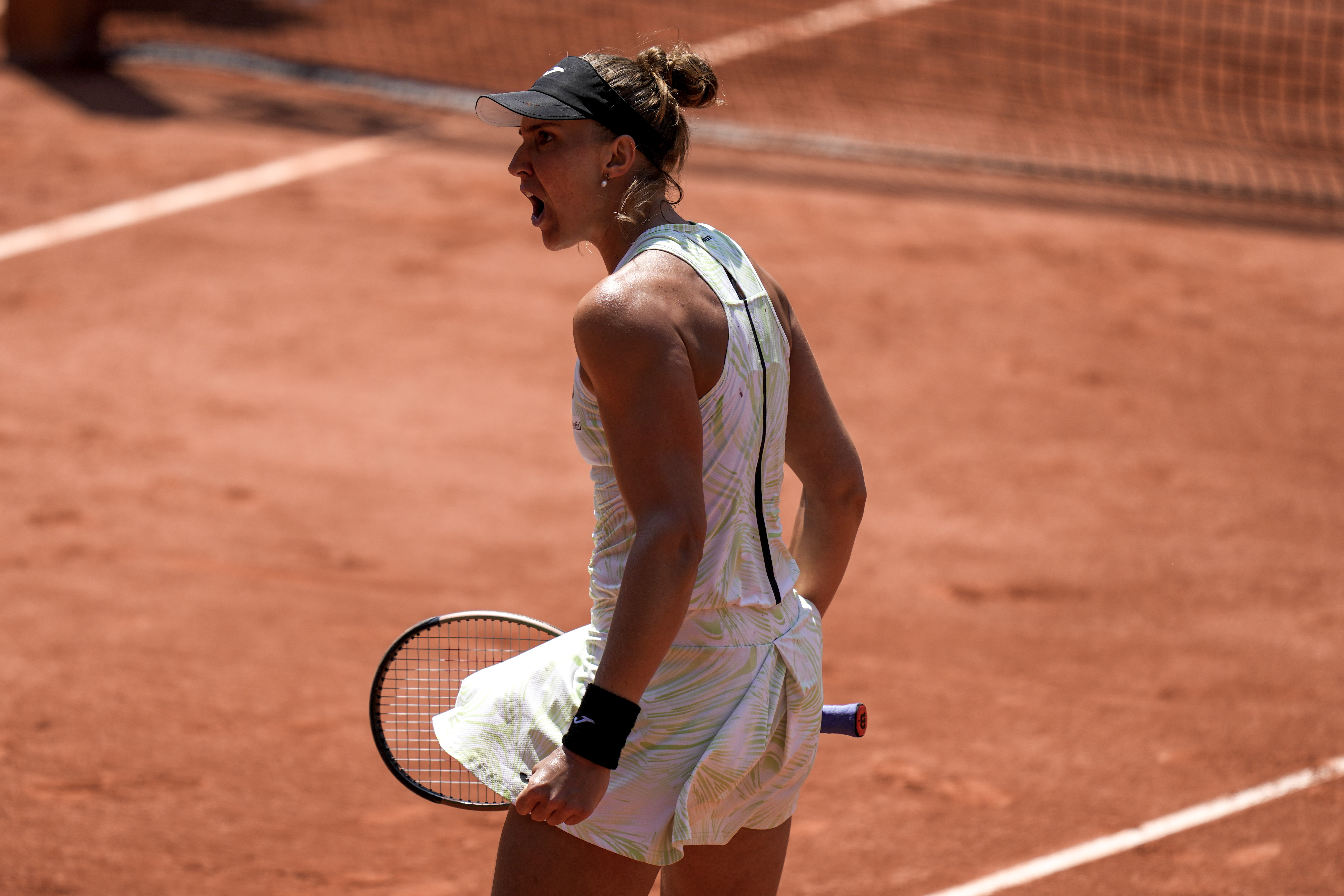 Brazil's Beatriz Haddad Maia celebrates after winning the second set against Tunisia's Ons Jabeur during their quarterfinal match of the French Open tennis tournament at the Roland Garros stadium in Paris, Wednesday, June 7, 2023.
