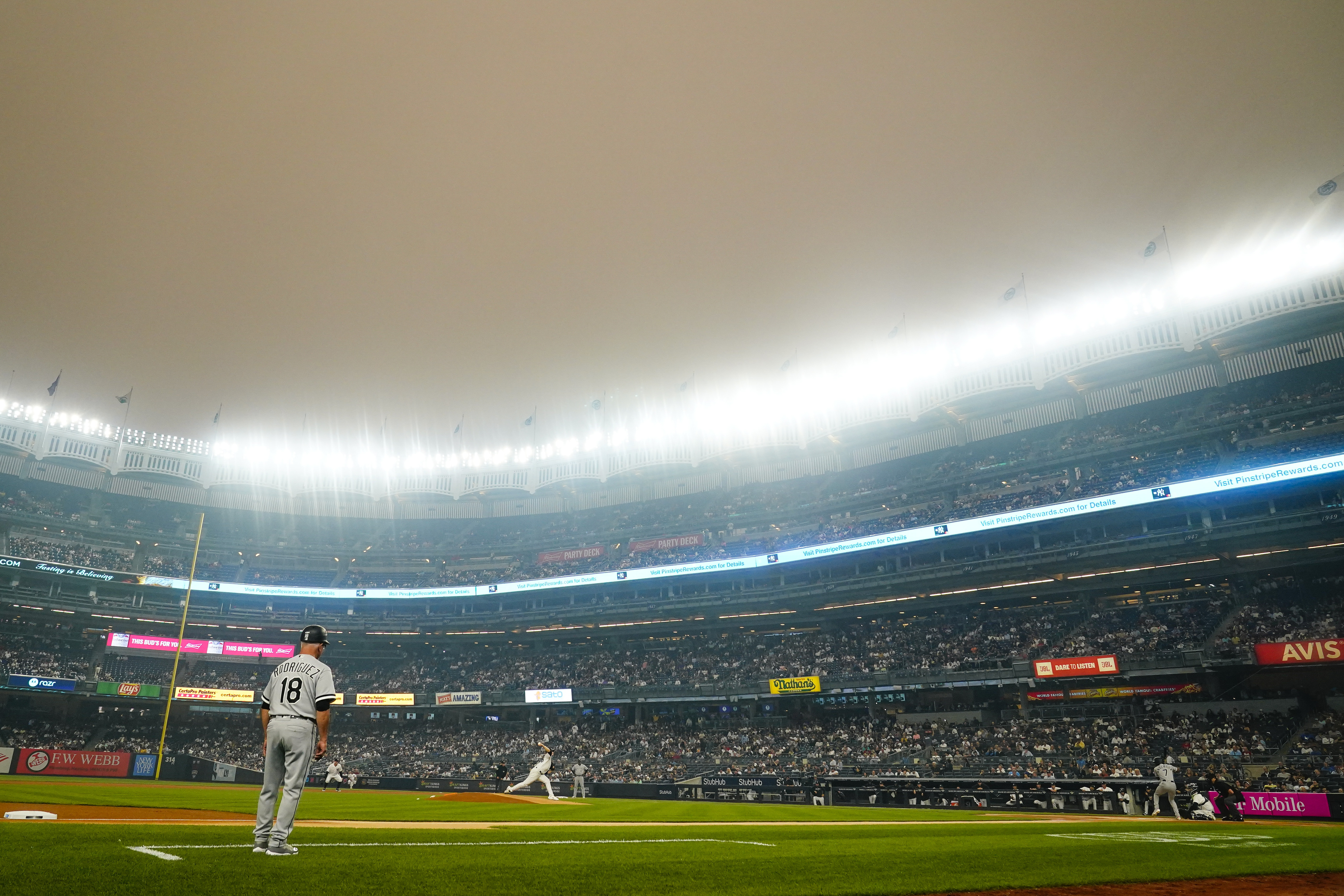New York Yankees' Clarke Schmidt pitches to Chicago White Sox's Tim Anderson during the first inning of a baseball game Tuesday, June 6, 2023, in New York. Smoke from Canadian wildfires has traveled into the United States, resulting in a number of air quality alerts issued since May.