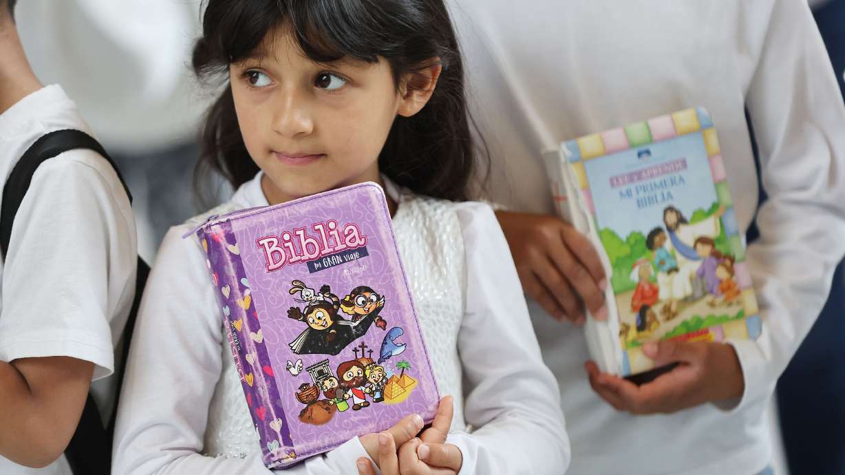 Belen Zavala, 5, holds her Bible during a protest at the Capitol Wednesday to voice concern regarding the decision of the Davis County School District to remove the Bible from area schools.
