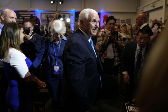 Republican presidential candidate former Vice President Mike Pence greets audience members at a campaign event, Wednesday in Ankeny, Iowa.