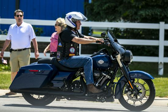 Former Vice President Mike Pence rides a motorcycle during U.S. Sen. Joni Ernst's Roast and Ride, June 3 in Des Moines, Iowa.