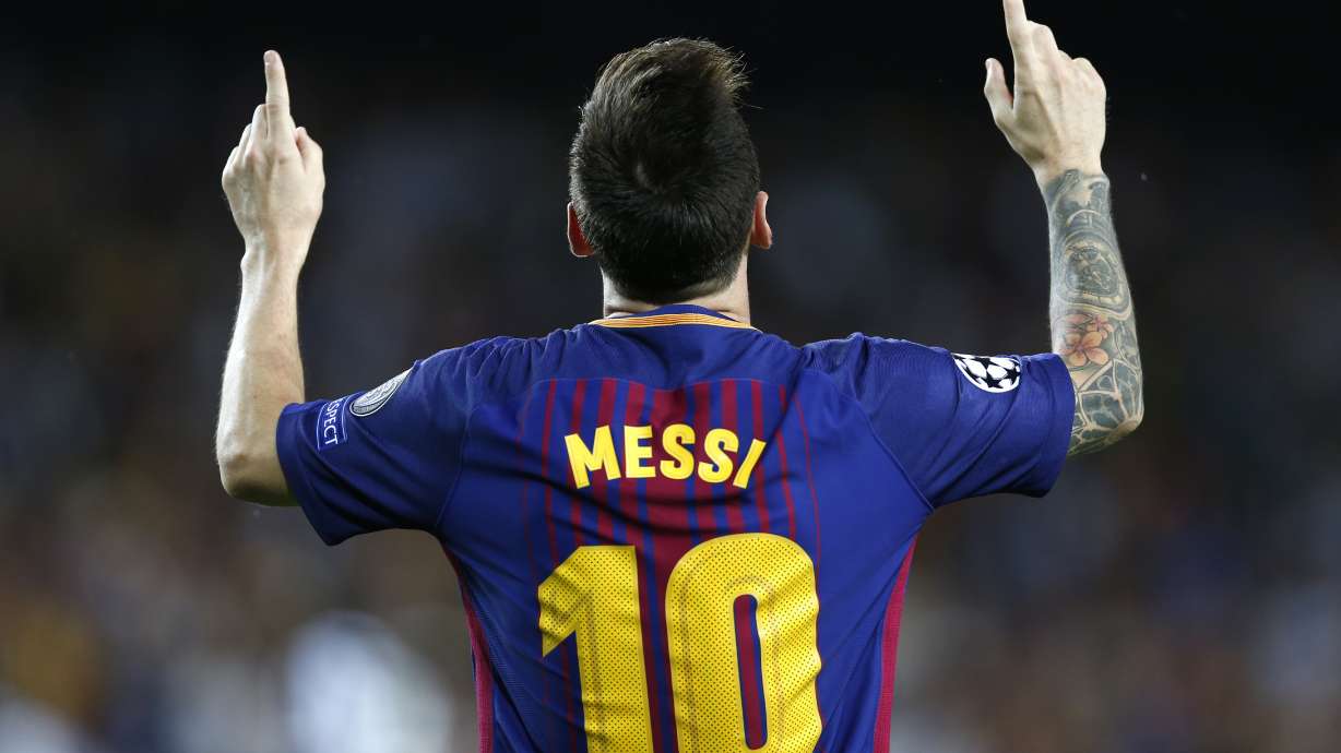 FILE - Barcelona's Lionel Messi celebrates after scoring his side's first goal during a Champions League group D soccer match between FC Barcelona and Juventus at the Camp Nou stadium in Barcelona, Spain, Tuesday, Sept. 12, 2017. Lionel Messi says he is coming to Inter Miami and joining Major League Soccer. After months of speculation, Messi announced his decision Wednesday, June 7, 2023,to join a Miami franchise that has been led by another global soccer icon in David Beckham since its inception but has yet to make any real splashes on the field.