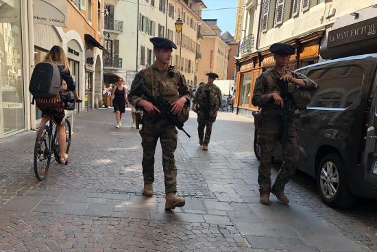 Soldiers patrol after a knife attack in Annecy, French Alps, Thursday. An attacker with a knife stabbed several young children and at least one adult, leaving some with life-threatening injuries, in a town in the Alps on Thursday before he was arrested, authorities said.