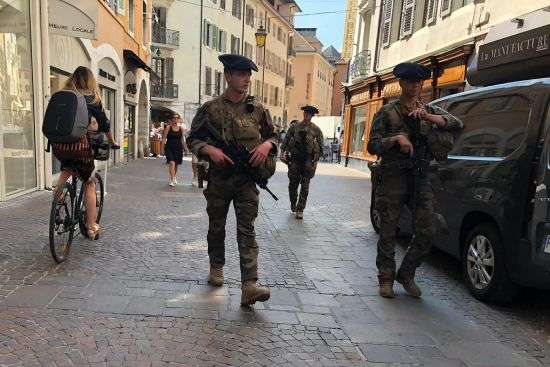 Soldiers patrol after a knife attack in Annecy, French Alps, Thursday. An attacker with a knife stabbed several young children and at least one adult, leaving some with life-threatening injuries, in a town in the Alps on Thursday before he was arrested, authorities said.