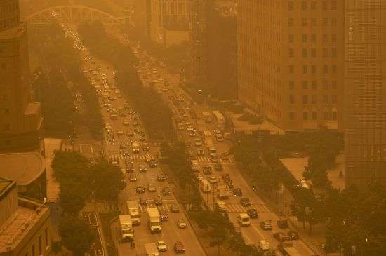 Traffic moves along Wednesday in New York, amidst smokey haze from wildfires in Canada. Smoke from Canadian wildfires poured into the U.S. East Coast and Midwest on Wednesday, covering the capitals of both nations in an unhealthy haze, holding up flights at major airports and prompting people to fish out pandemic-era face masks.