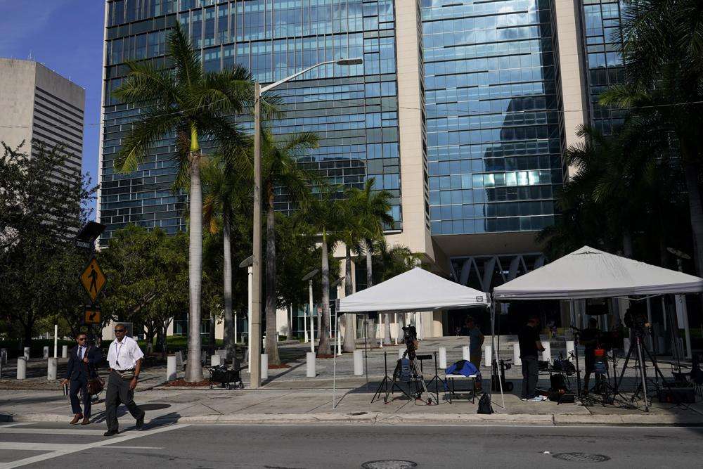 News media are set up outside of the Wilkie D. Ferguson Jr. U.S. Courthouse where a grand jury is meeting, Wednesday in Miami. Federal prosecutors are using a grand jury in Florida as part of an investigation into the possible mishandling of classified documents at former President Donald Trump's Palm Beach property, a personal familiar with the matter told the Associated Press.
