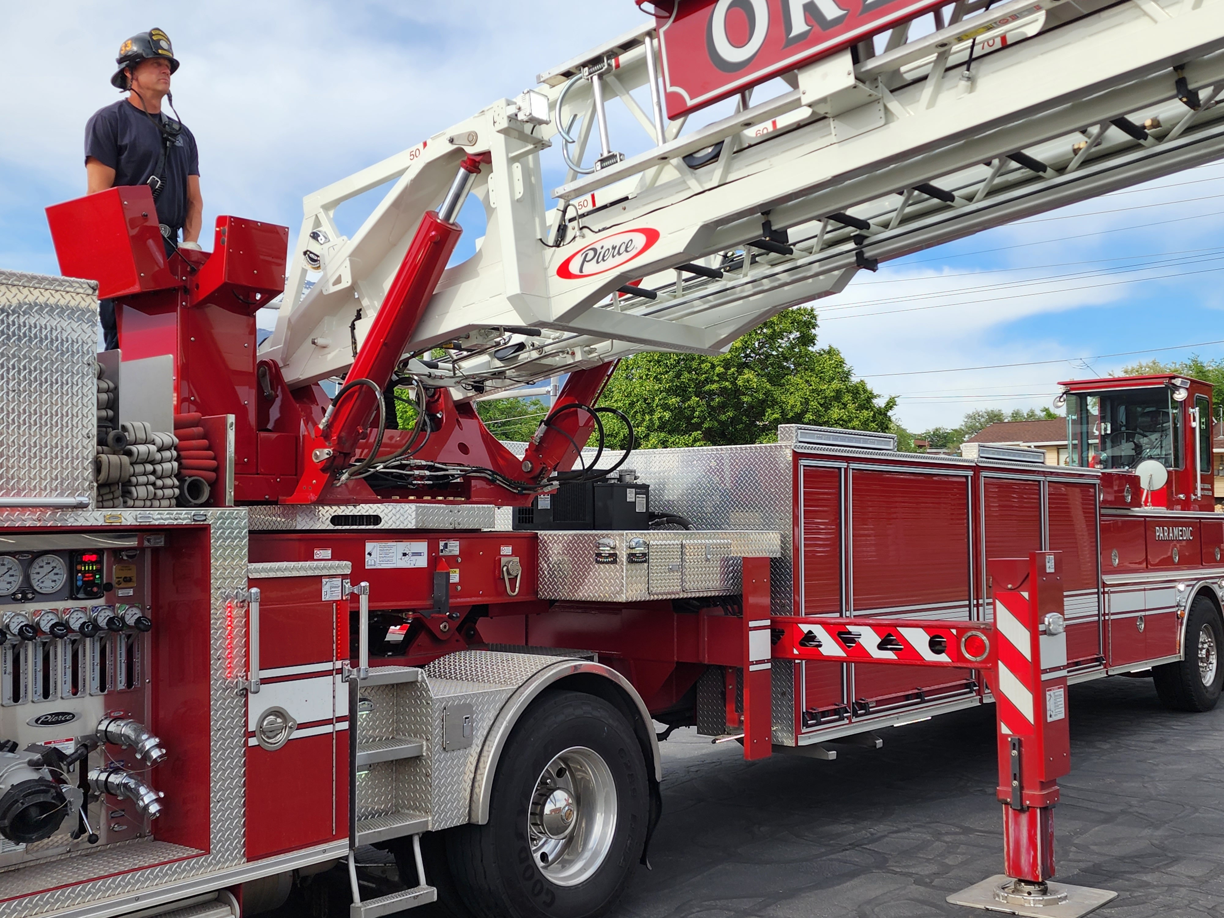 Orem Fire Department engineer Jayme Rigler controls and stabilizes the new tiller truck's aerial ladder. The department is well-situated to help in traumatic situations.