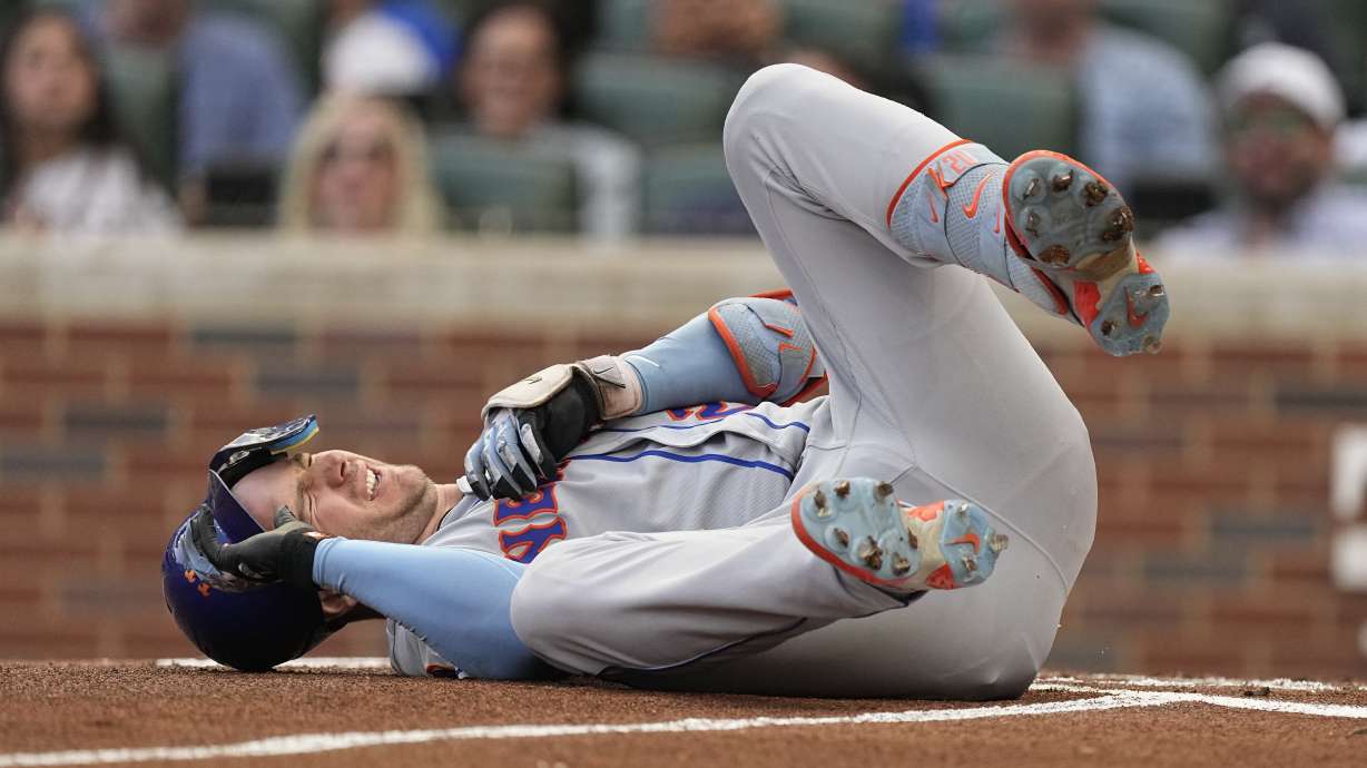 New York Mets first baseman Pete Alonso reacts after being hit by a pitch from Atlanta Braves starting pitcher Charlie Morton in the first inning of a baseball game, Wednesday, June 7, 2023, in Atlanta. Alonzo left the game and went into the clubhouse for treatment.