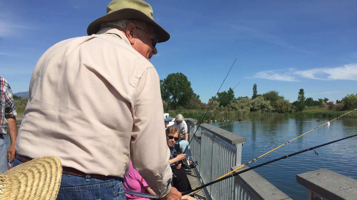 An undated photo of people fishing at Sandy Pond in Sandy. Utah's "Free Fishing Day" is Saturday.