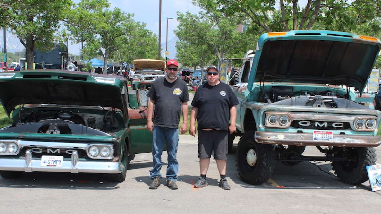 Matt and Marty Carrillo stand by each other's vintage GMC trucks at the UVU Auto Expo in May.