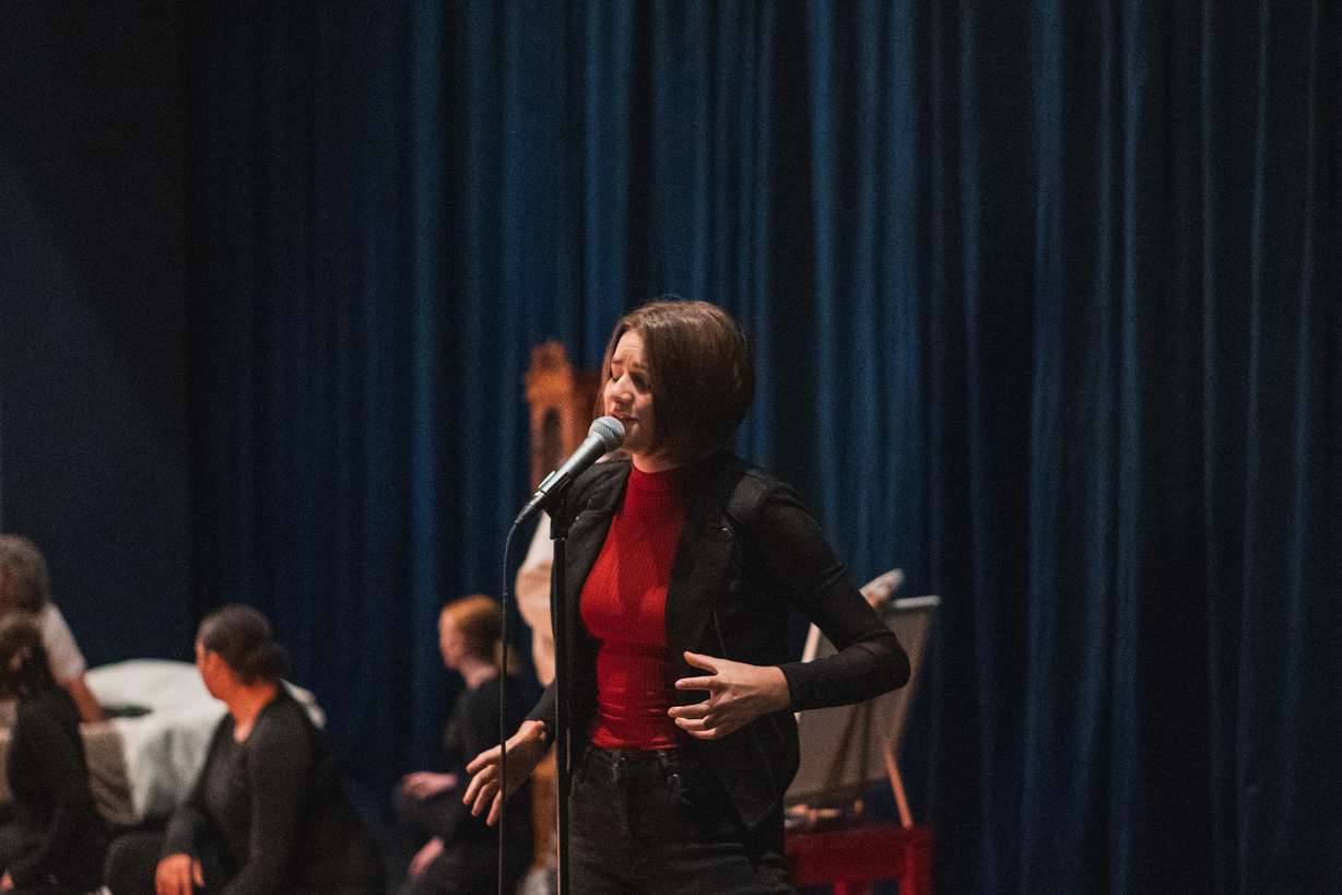 Kjersti Long sings during a rehearsal for "Relative Space: An Atypical Musical" on May 13. The show depicts mental health challenges in a rock concert theatrical drama that will debut in Pleasant Grove.