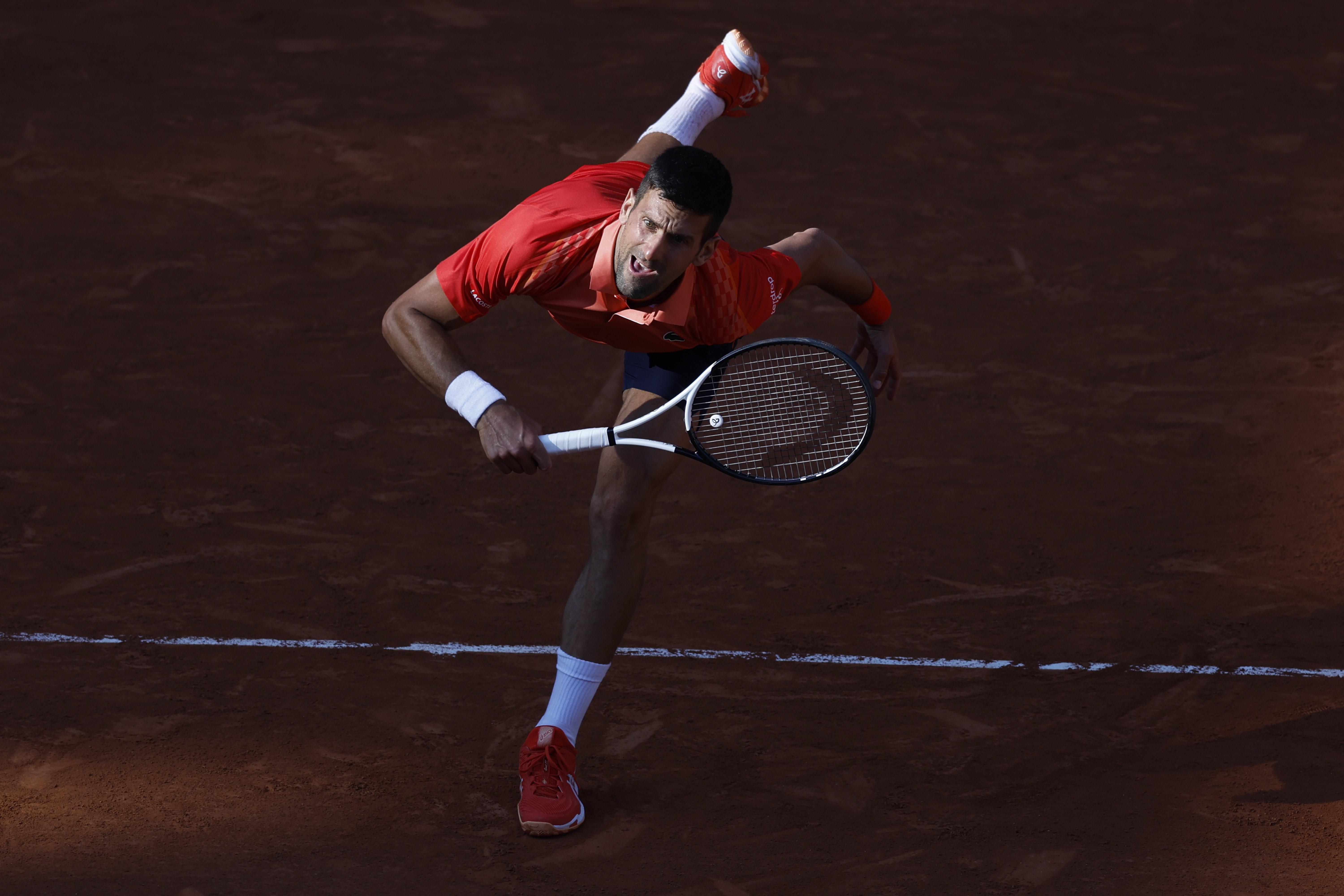 Serbia's Novak Djokovic serves against Russia's Karen Khachanov during their quarterfinal match of the French Open tennis tournament at the Roland Garros stadium in Paris, Tuesday, June 6, 2023.