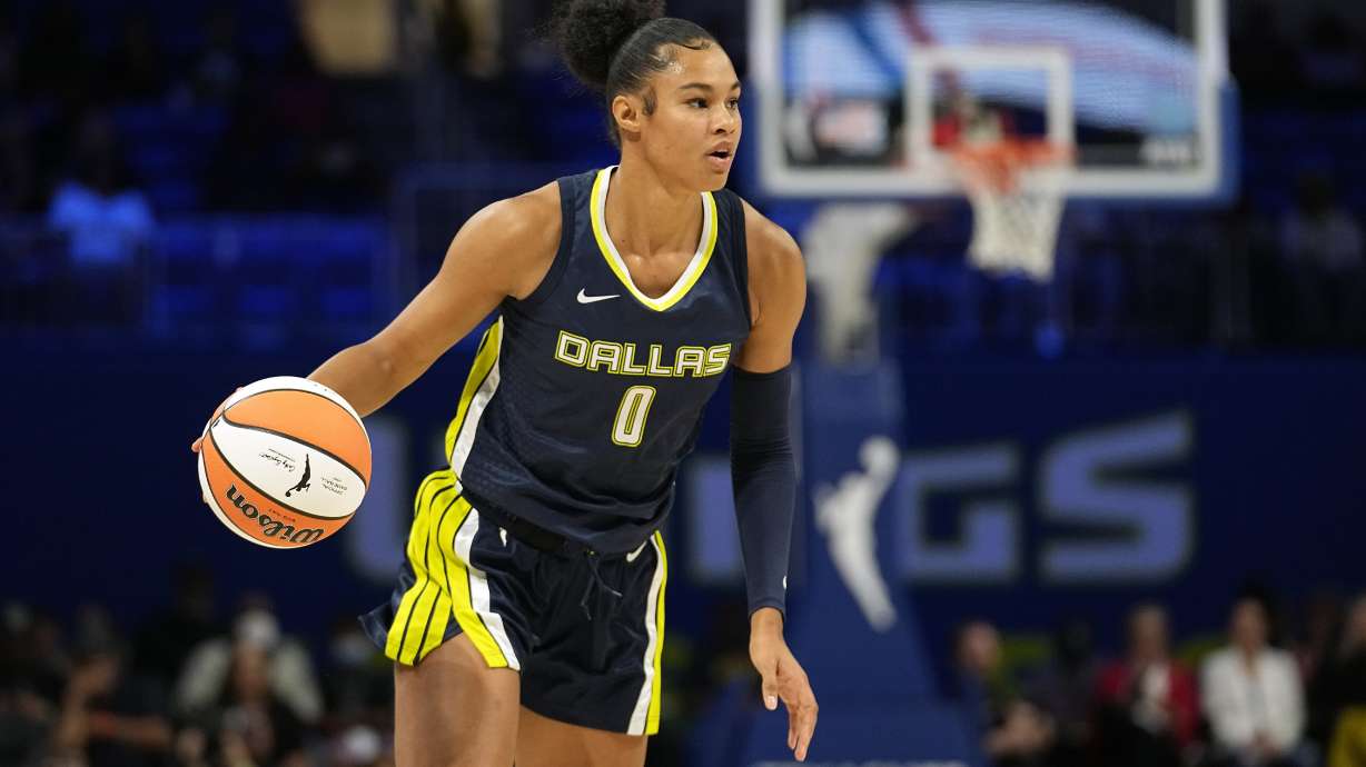 Dallas Wings forward Satou Sabally brings the ball up during the team's WNBA basketball game against the Phoenix Mercury, June 7, 2023, in Arlington, Texas. Satou and Nyara Sabally were never competitive against each other growing up in Germany. Their mom made sure of that. The sisters, two years apart in age, will play against each other for the first time ever when Dallas visits New York on Sunday.