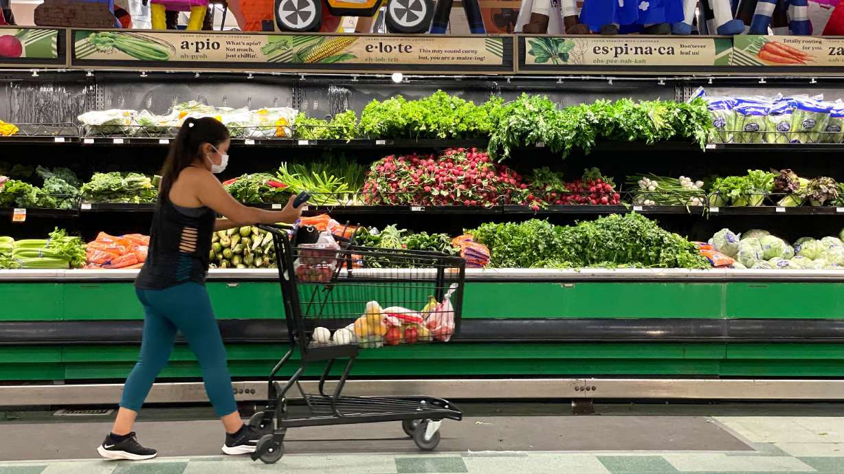 A customer shops for produce at a Cardenas Market on June 8, 2022, in San Rafael, Calif.