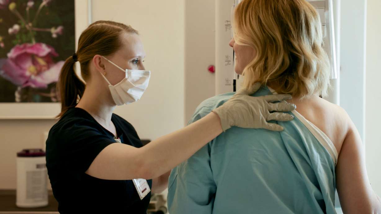 Radiologic technologist Holly Speer performs a mammogram on Heather Simonsen at the Huntsman Cancer Hospital in Salt Lake City on April 7. Utah failed to meet its goal of screening 76% of women aged 40 or older by 2020, officials said.