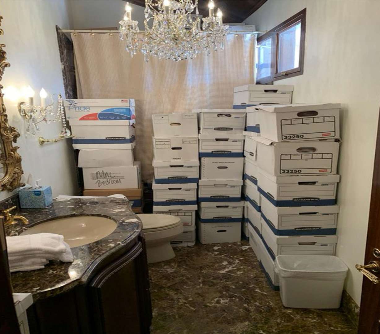This image, contained in the indictment against former President Donald Trump, shows boxes of records stored in a bathroom and shower in the Lake Room at Trump’s Mar-a-Lago estate in Palm Beach, Fla.