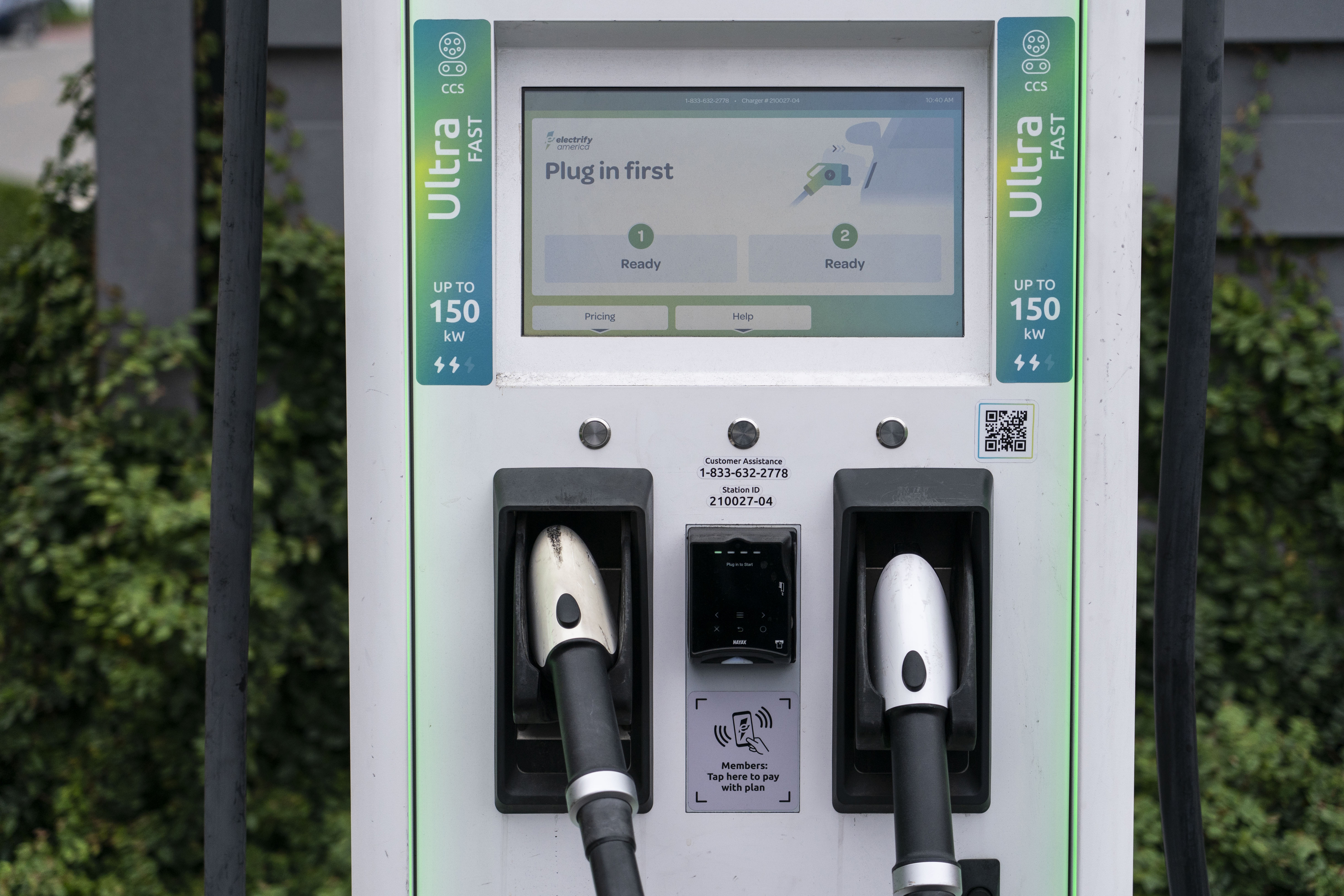 A charging station with Combined Charging System plugs is seen in Anaheim, Calif., Friday. Owners of General Motors and Ford electric vehicles will be able to charge at many of Tesla's large network of stations across the U.S. starting next year. 