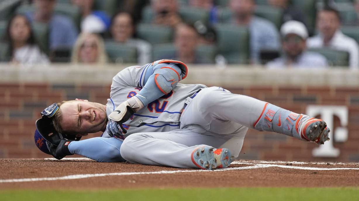 New York Mets first baseman Pete Alonso reacts after being hit by a pitch from Atlanta Braves starting pitcher Charlie Morton in the first inning of a baseball game, Wednesday, June 7, 2023, in Atlanta. Alonzo left the game and went into the clubhouse for treatment.