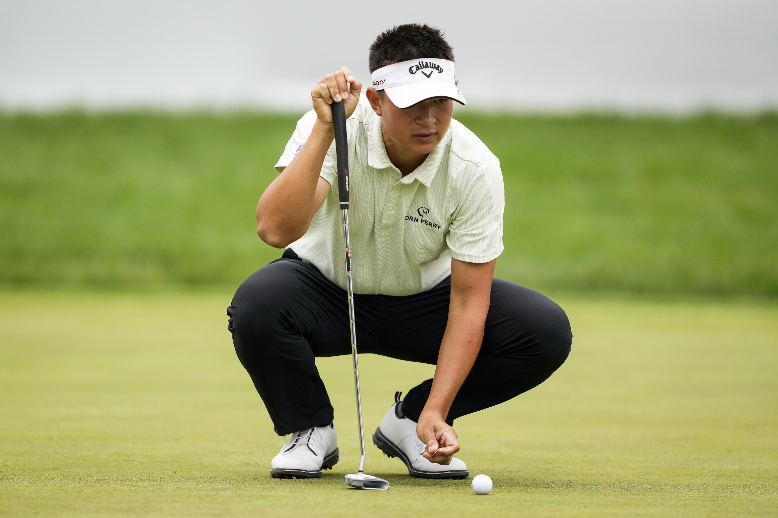 Carl Yuan lines up a putt on the 16th hole during the second round of the Canadian Open in Toronto, Ontario, Friday, June 9, 2023.
