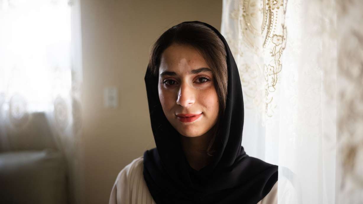Mahsa Qaderi, an Afghani refugee by way of Kabul, poses for a portrait at her home in West Valley City on Friday. Qaderi is a young girl from Afghanistan whose dream of becoming a computer programmer was thwarted by high tuition costs.