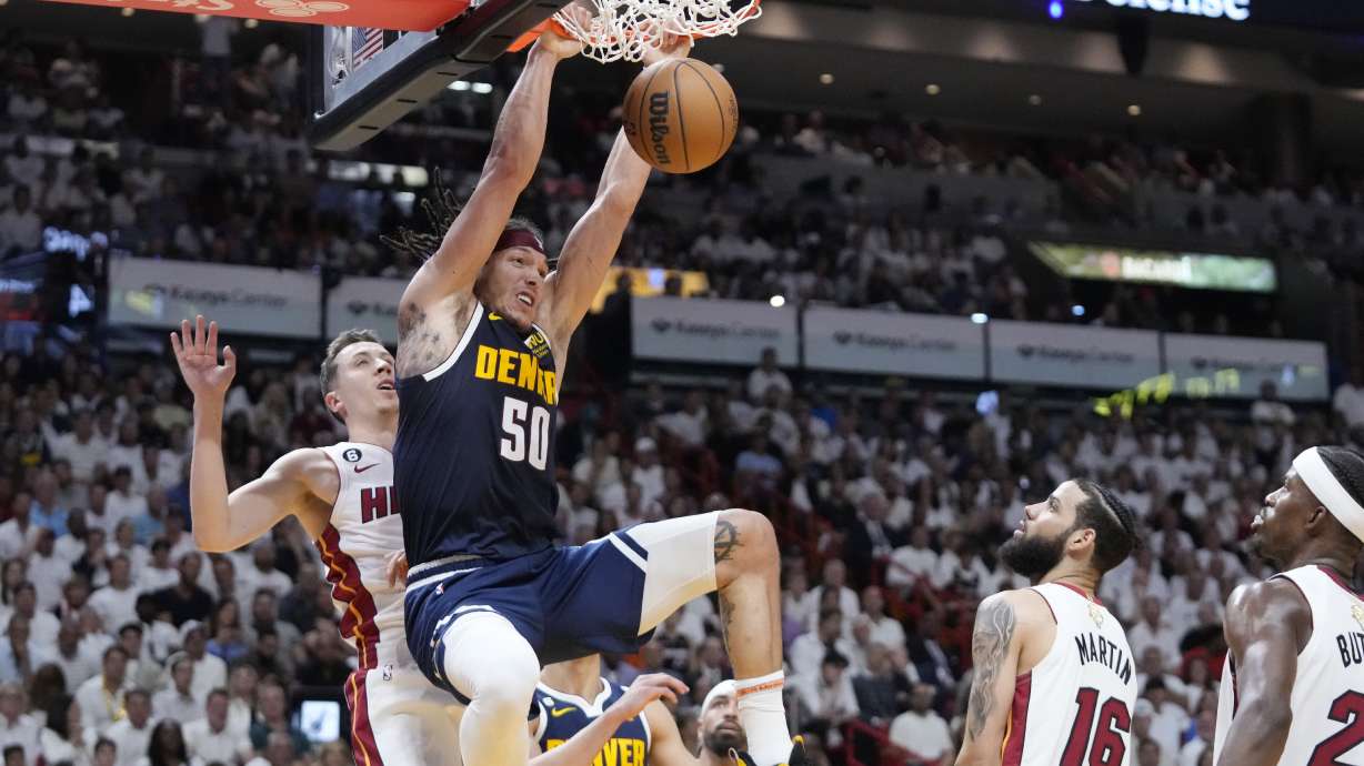 Denver Nuggets forward Aaron Gordon (50)dunks the ball during the first half of Game 4 of the basketball NBA Finals against the Miami Heat, Friday, June 9, 2023, in Miami.