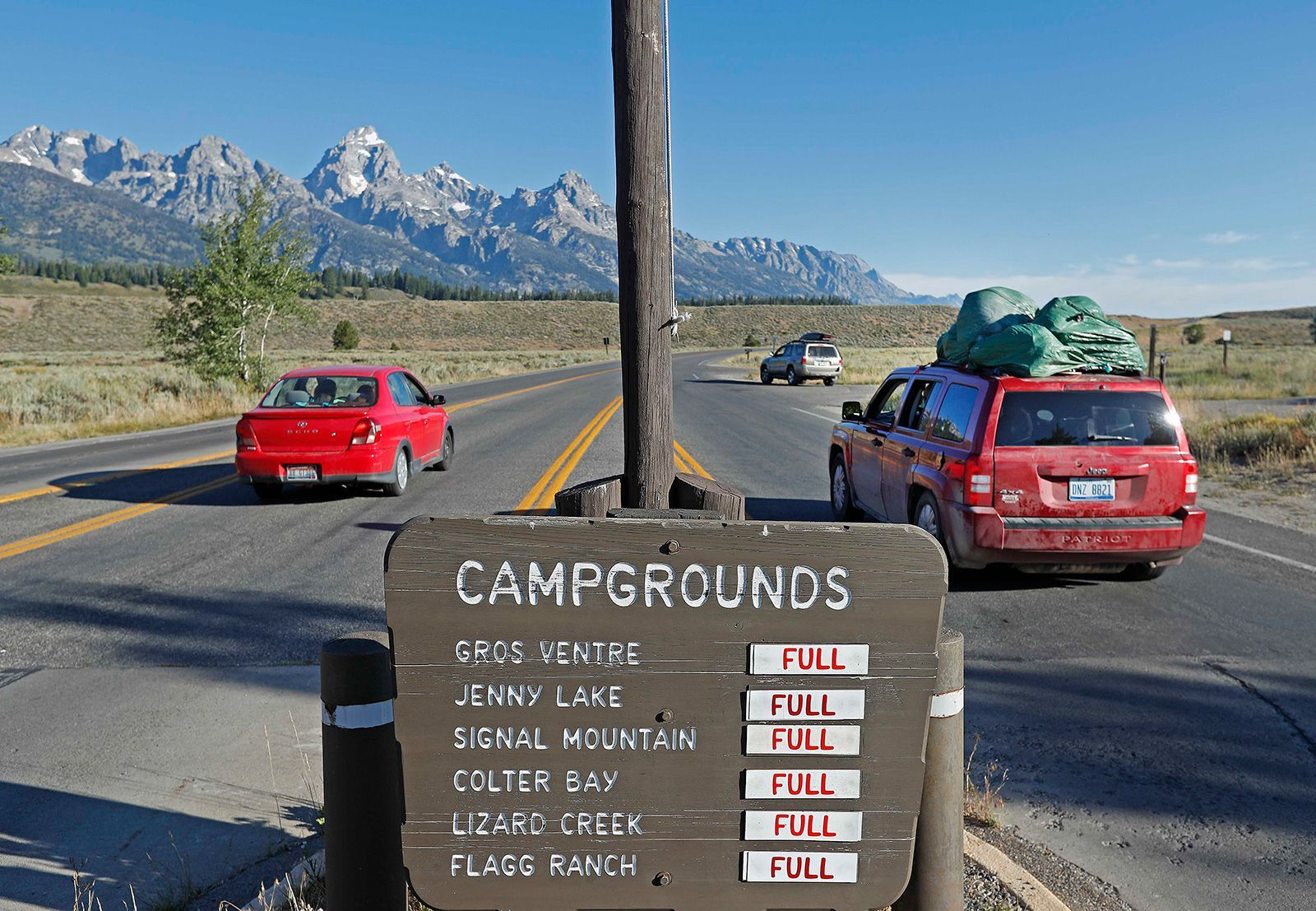 Signs show full campgrounds in Grand Teton National Park on Aug. 19, 2017, outside Jackson, Wyo. Grand Teton was in the path of totality.