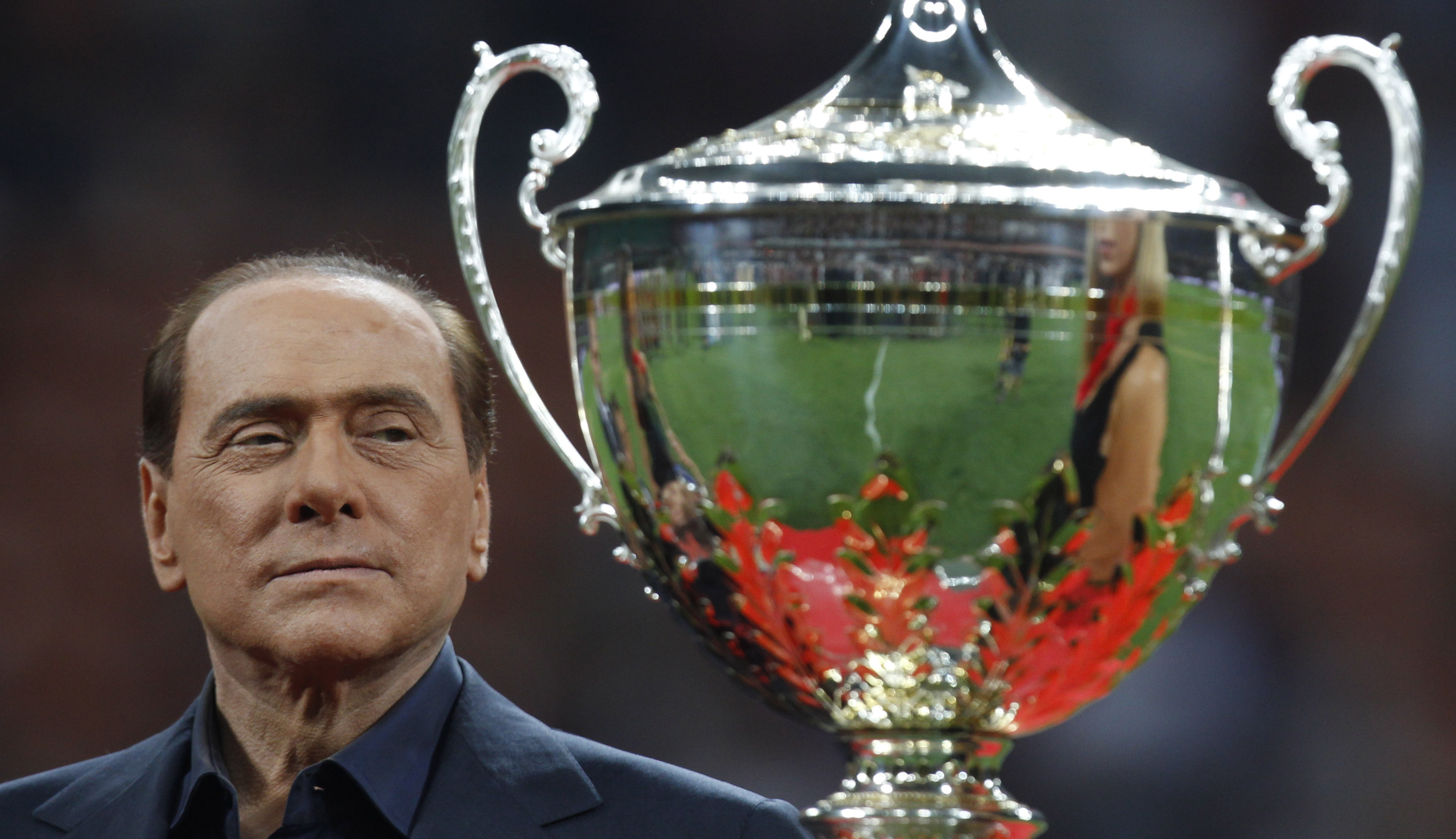 FILE - Italian Premier Silvio Berlusconi attends the presentation of the 'Berlusconi trophy' after a soccer match between AC Milan and Juventus at the San Siro stadium in Milan, Italy, Aug. 21, 2011. From his grand entrance by helicopter after buying AC Milan to empowering Monza up to Serie A for the first time in its history, Silvio Berlusconi dominated Italian soccer for decades just like he commanded the show in Italian politics. Berlusconi, a former three-time Italian premier, died Monday, according to his television network. He was 86. 