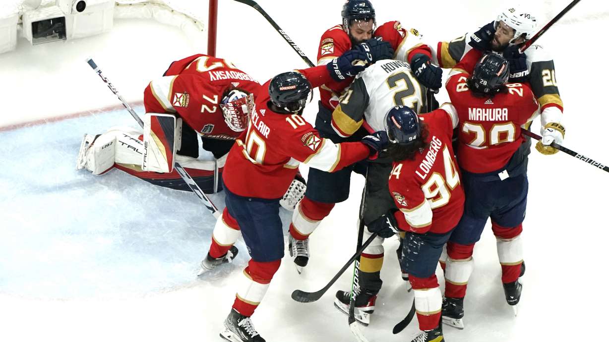 Florida Panthers defenseman Radko Gudas, center, and defenseman Josh Mahura (28) scuffle with Vegas Golden Knights Brett Howden (21) and center Chandler Stephenson (20) during the third period in Game 4 of the NHL hockey Stanley Cup Finals, Saturday, June 10, 2023, in Sunrise, Fla.
