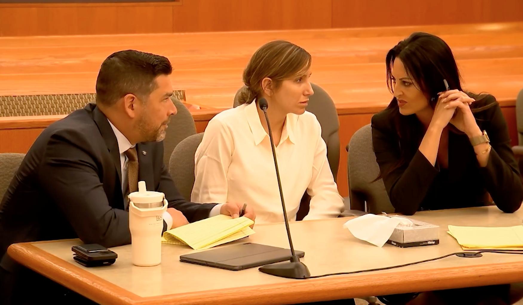 Kouri Richins, center, talks with her lawyers during a bail hearing in 3rd District Court in Park City on June 12. Prosecutors filed a notice in court on Friday stating they will not seek the death penalty if the Kamas mother is convicted of aggravated murder.