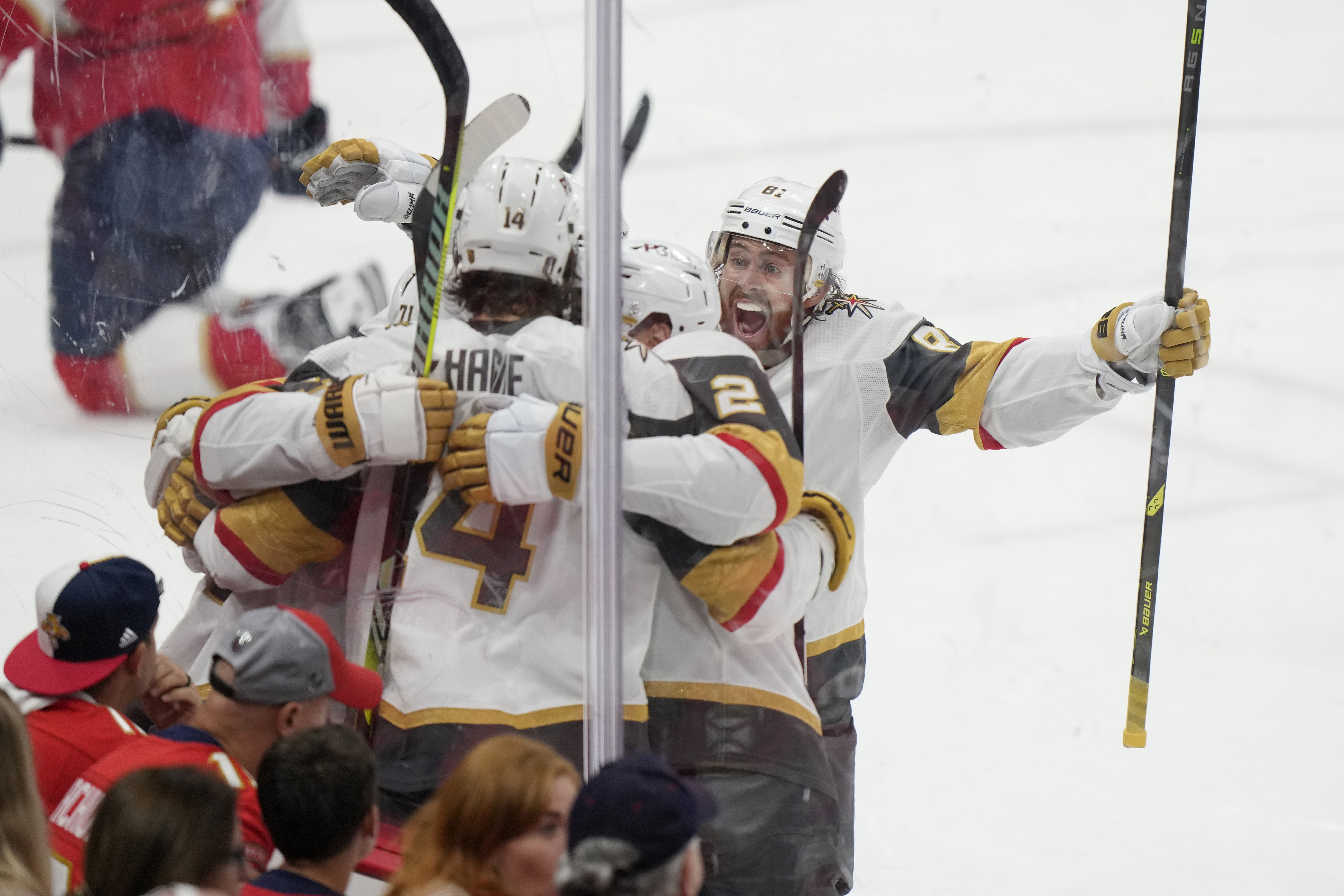 Vegas Golden Knights right wing Jonathan Marchessault (81) joins in congratulating center William Karlsson 
