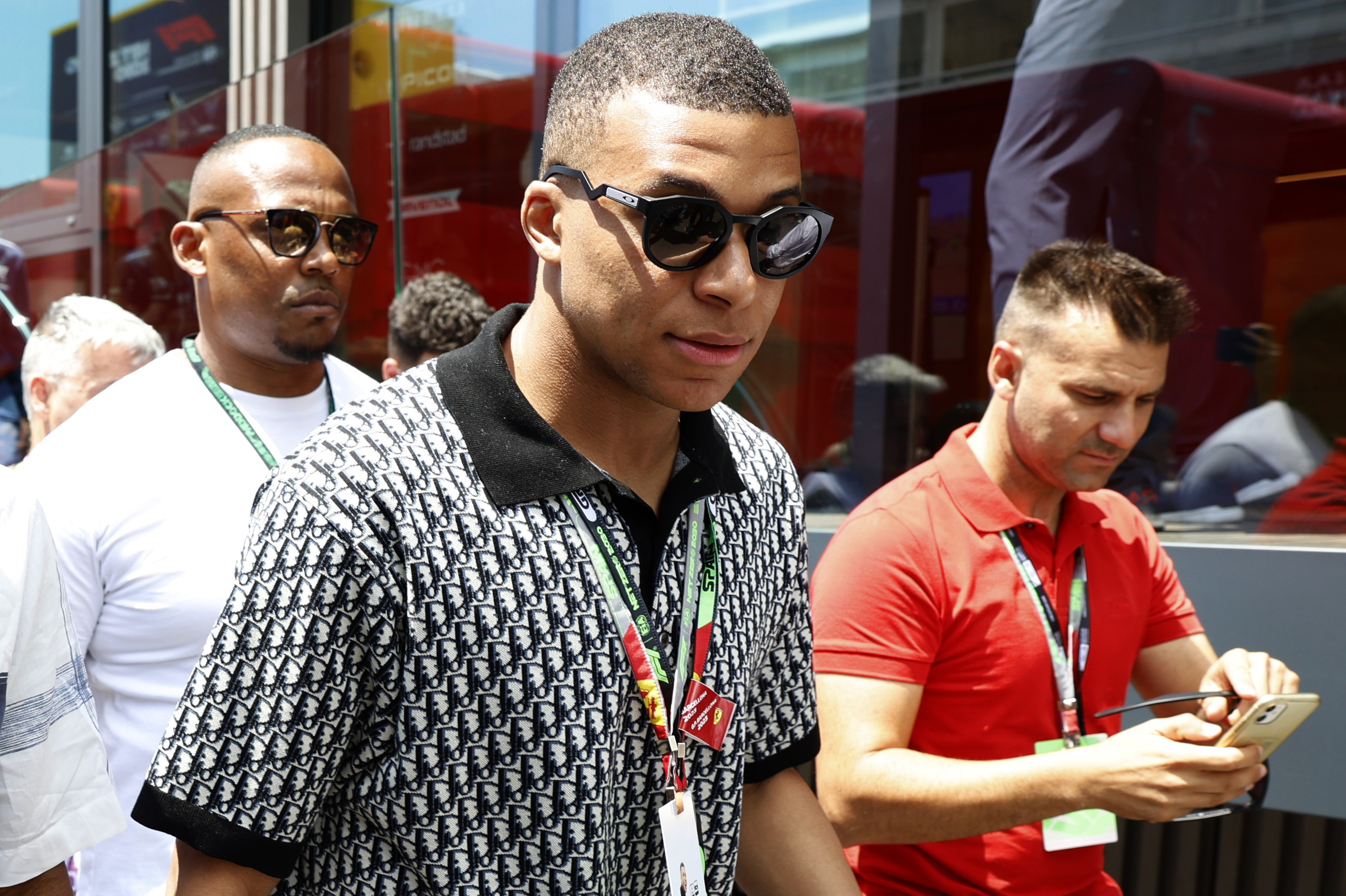 French footballer Kylian Mbappe walks through the paddock before the start of the Spanish Formula One Grand Prix at the Barcelona Catalunya racetrack in Montmelo, Spain, Sunday, June 4, 2023. 