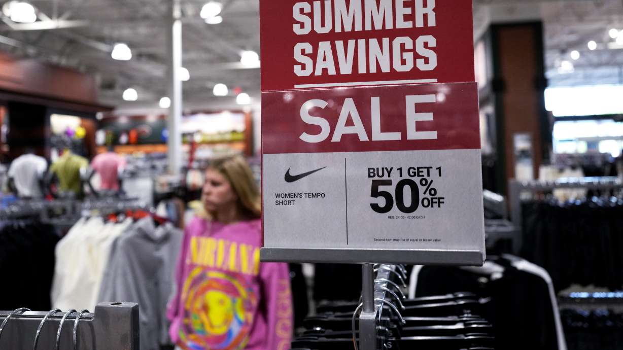 A sale sign is displayed at a retail store in Vernon Hills, Ill., Monday. On Tuesday, the Labor Department reported consumer price growth slowed last month.