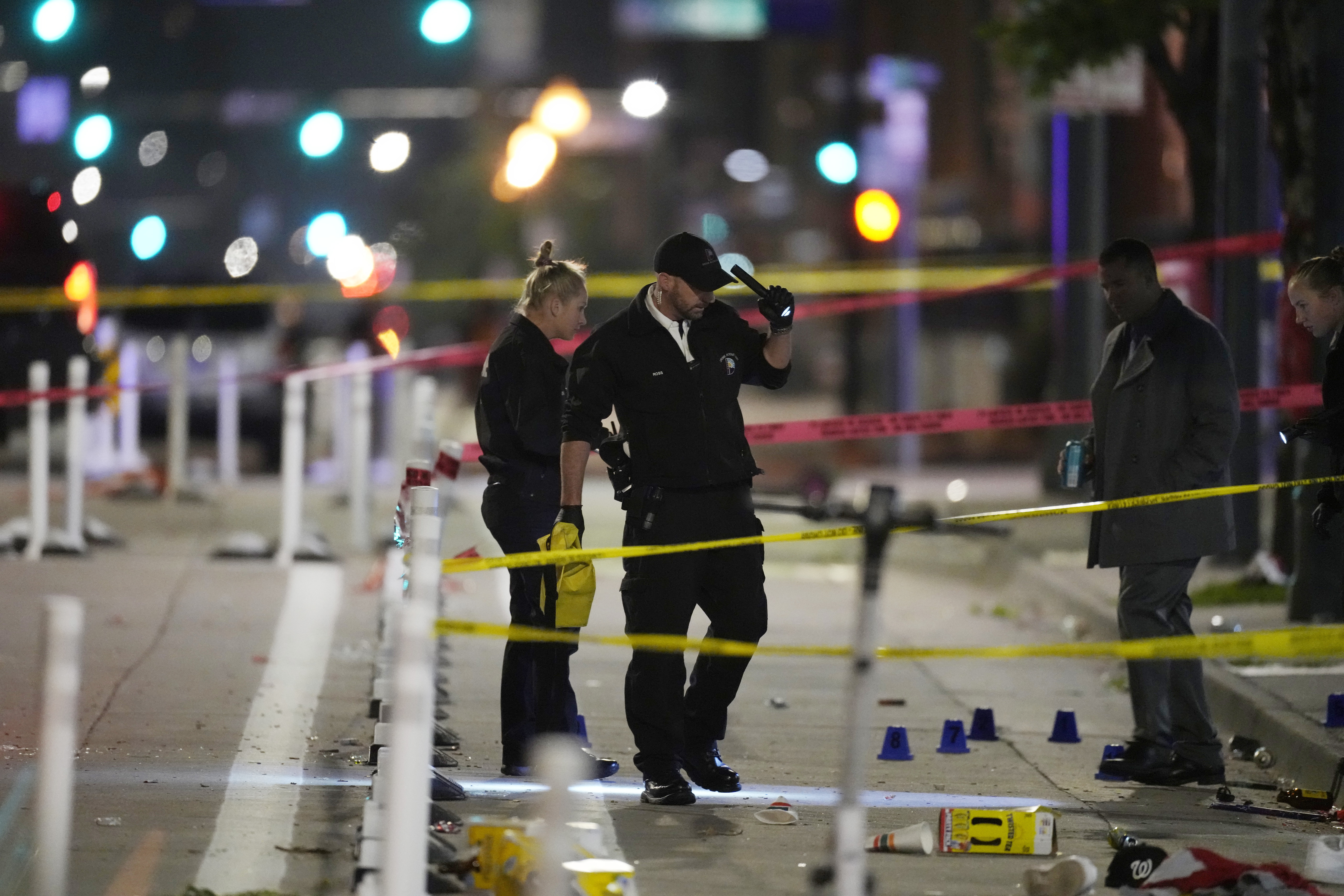 Denver Police Department investigators work the scene of a mass shooting along Market Street between 20th and 21st avenues during a celebration after the Denver Nuggets won the team's first NBA Championship early Tuesday, June 13, 2023, in Denver. 