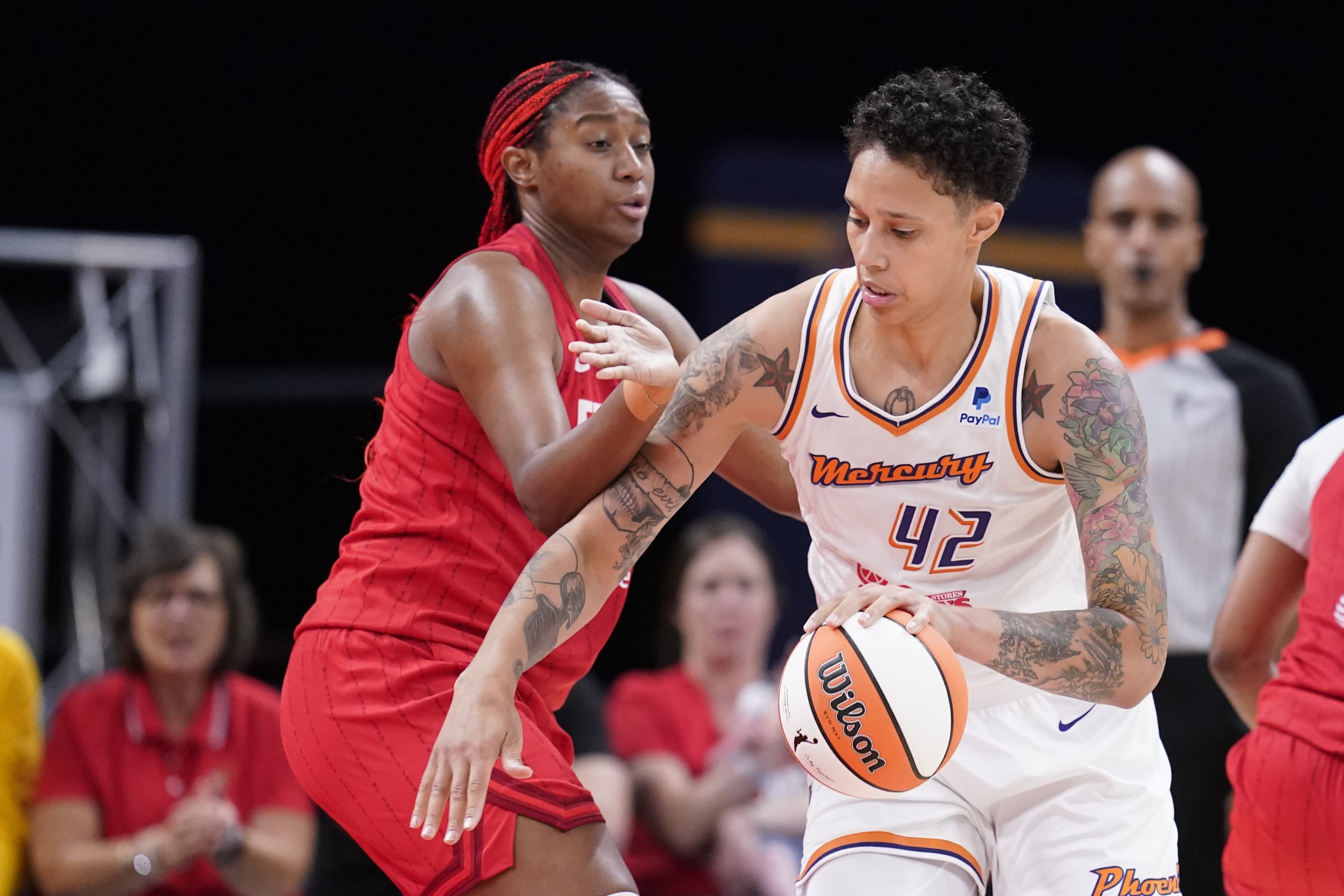 Phoenix Mercury's Brittney Griner (42) goes to the basket against Indiana Fever's Aliyah Boston, front left, during the second half of a WNBA basketball game, Sunday, June 11, 2023, in Indianapolis. 