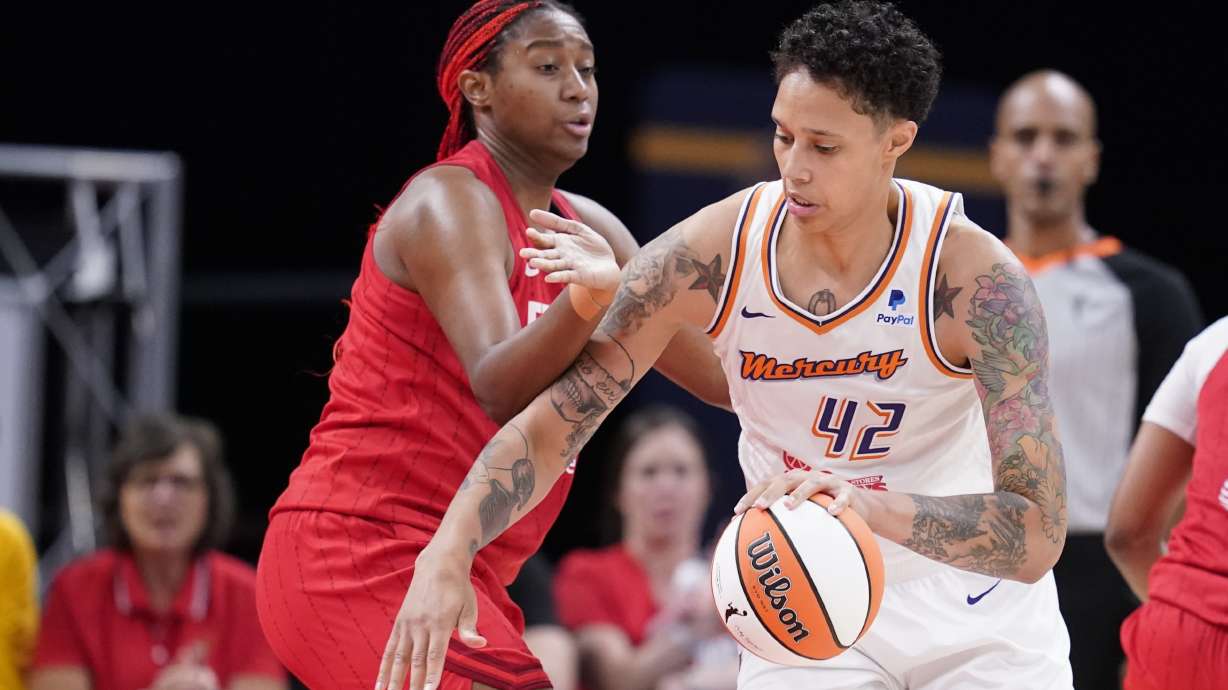 Phoenix Mercury's Brittney Griner (42) goes to the basket against Indiana Fever's Aliyah Boston, front left, during the second half of a WNBA basketball game, Sunday, June 11, 2023, in Indianapolis.