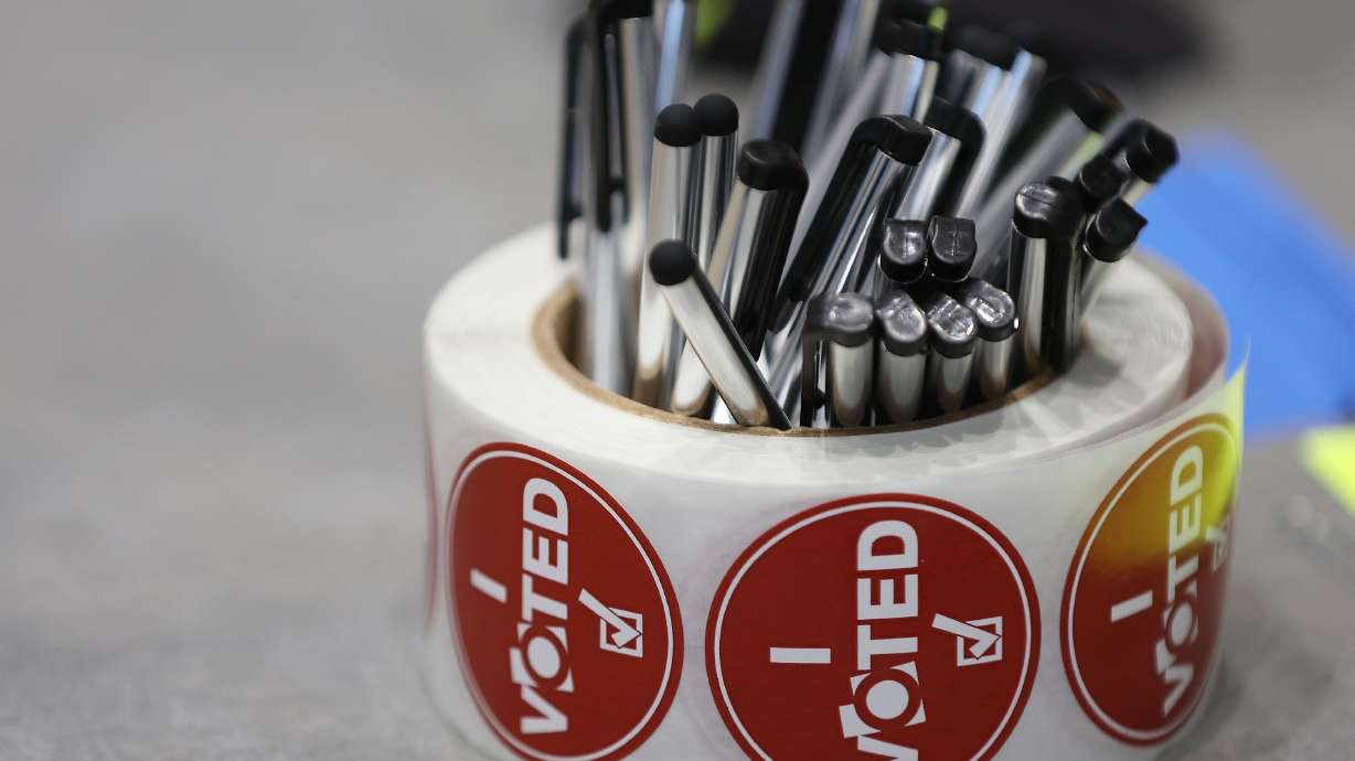 “I voted” stickers and pens on Election Day in Cottonwood Heights on Nov. 8, 2022. The Utah Legislature will meet in a special session Tuesday to change election dates in order to hold a special election to replace Rep. Chris Stewart.