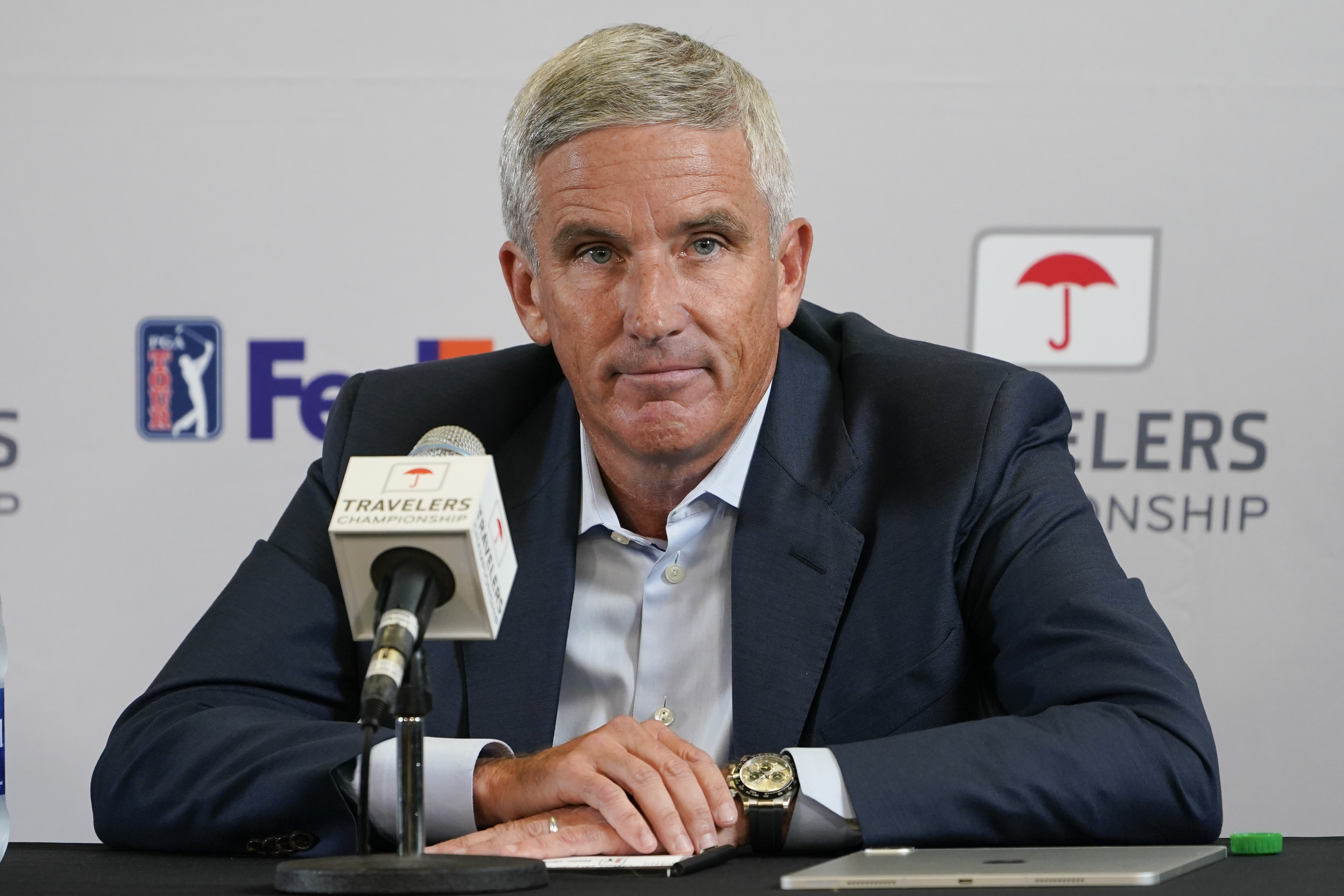 FILE - PGA Tour Commissioner Jay Monahan speaks during a news conference before the start of the Travelers Championship golf tournament at TPC River Highlands, Wednesday, June 22, 2022, in Cromwell, Conn. The most disruptive year in golf ended Tuesday, June 6, 2023, when the PGA Tour and European tour agreed to a merger with Saudi Arabia's golf interests, creating a commercial operation designed to unify professional golf around the world.