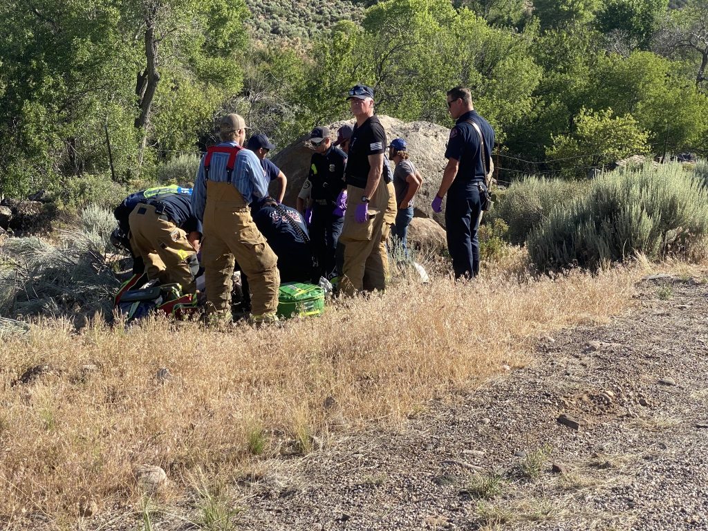 Emergency responders tend to a motorcyclist injured on Gunlock Road on Tuesday.