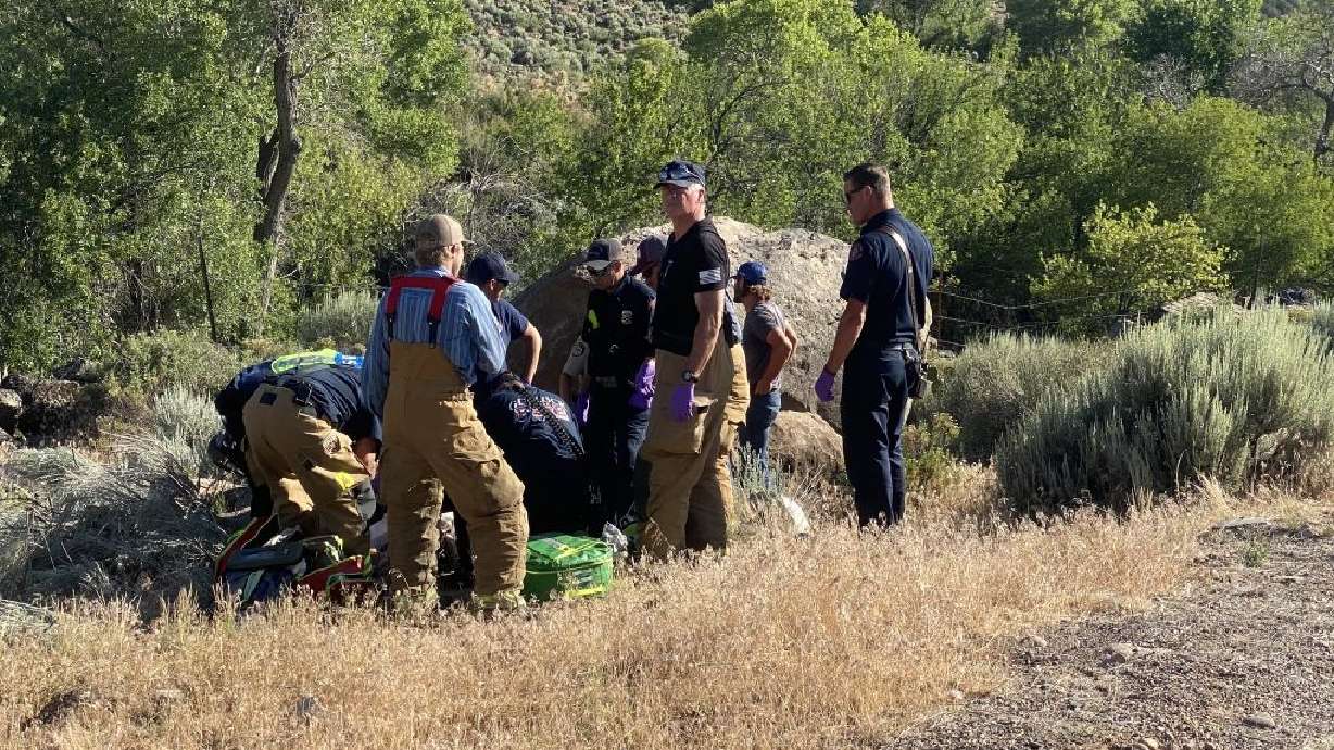 Emergency responders tend to a motorcyclist injured on Gunlock Road on Tuesday.