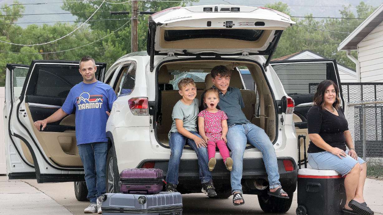 Nate, Tayven, Zenna, Braxton and Shanee Crosty pose for a portrait outside of their home in Layton on Monday. The family plans to road trip to Zion and Bryce Canyon National Parks this summer.