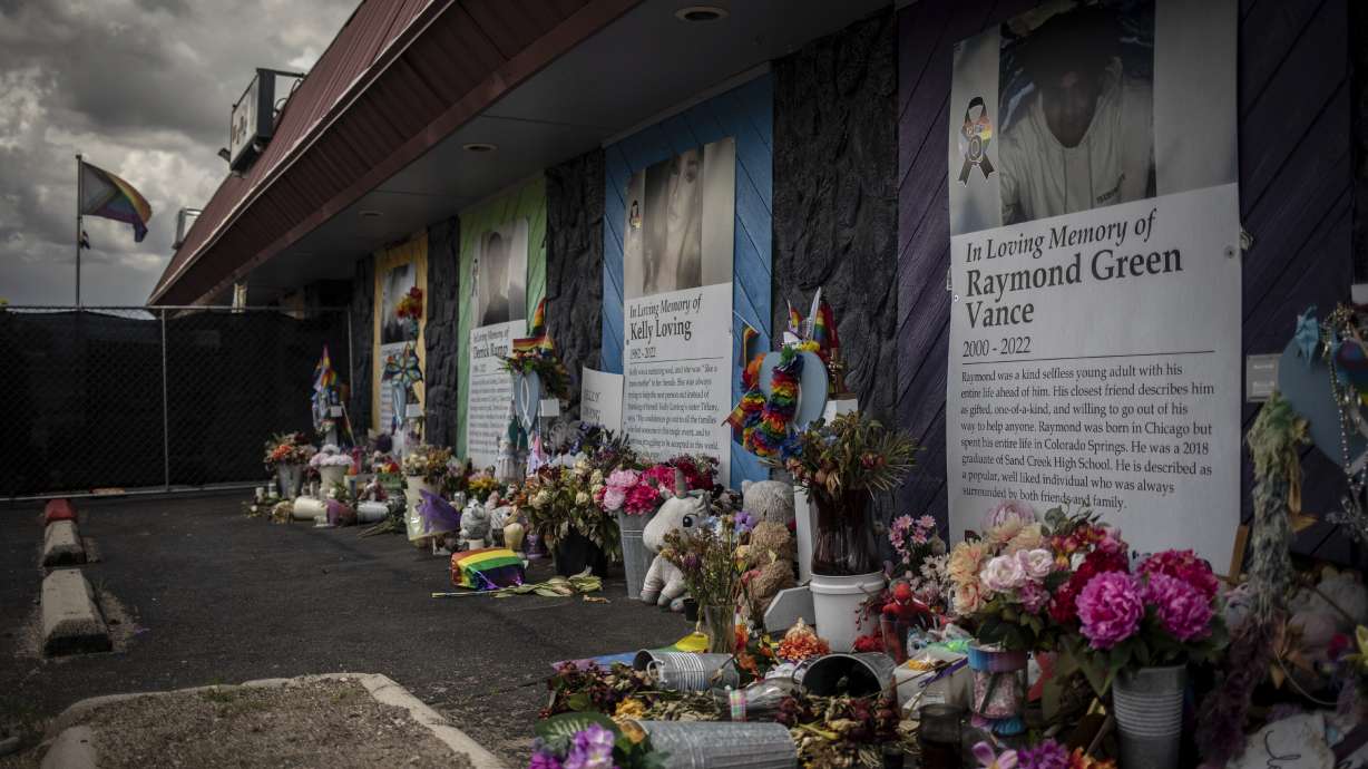 Memorials are displayed outside Club Q, the LGBTQ nightclub that was the site of a deadly 2022 shooting that killed five people, on June 7 in Colorado Springs, Colo. The suspect is expected to take a plea deal.