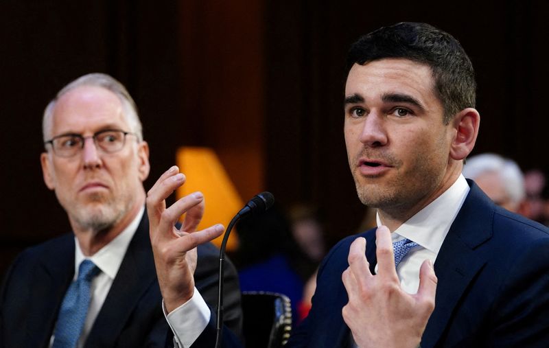 Live Nation Entertainment President and CFO Joe Berchtold listens as SeatGeek CEO Jack Groetzinger speaks during a Senate Judiciary Committee hearing on Capitol Hill in Washington, Jan. 24. Live Nation and Ticketmaster will soon offer consumers all-in pricing on their popular ticket platforms, the White House announced Thursday.
