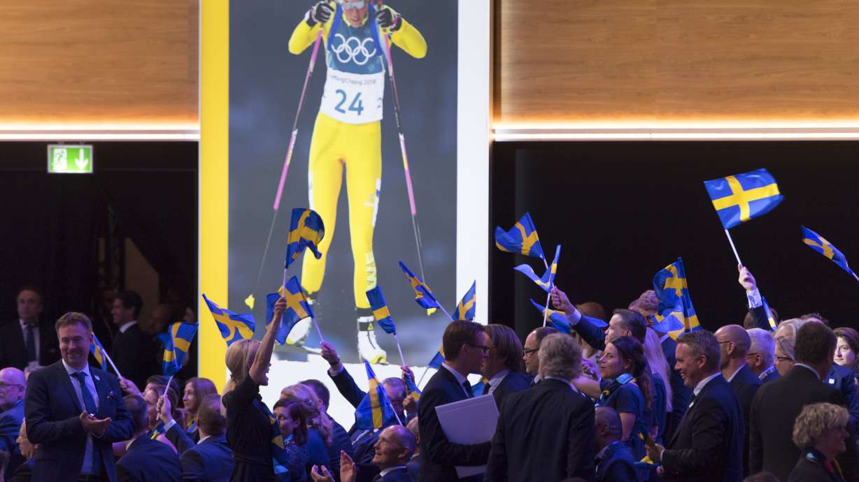 FILE - Stockholm-Are delegation members celebrate during the presentation final presentation of the Stockholm-Are candidate cities the first day of the 134th Session of the International Olympic Committee (IOC), at the SwissTech Convention Centre, in Lausanne, on June 24, 2019. Sweden is moving closer to a ninth bid to host the Winter Olympics for the first time in what's shaping up to be a race for the 2030 Games with only one obvious candidate. Swedish sports officials say there's a desire for the Nordic country to stage the Olympics following a four-month feasibility study.